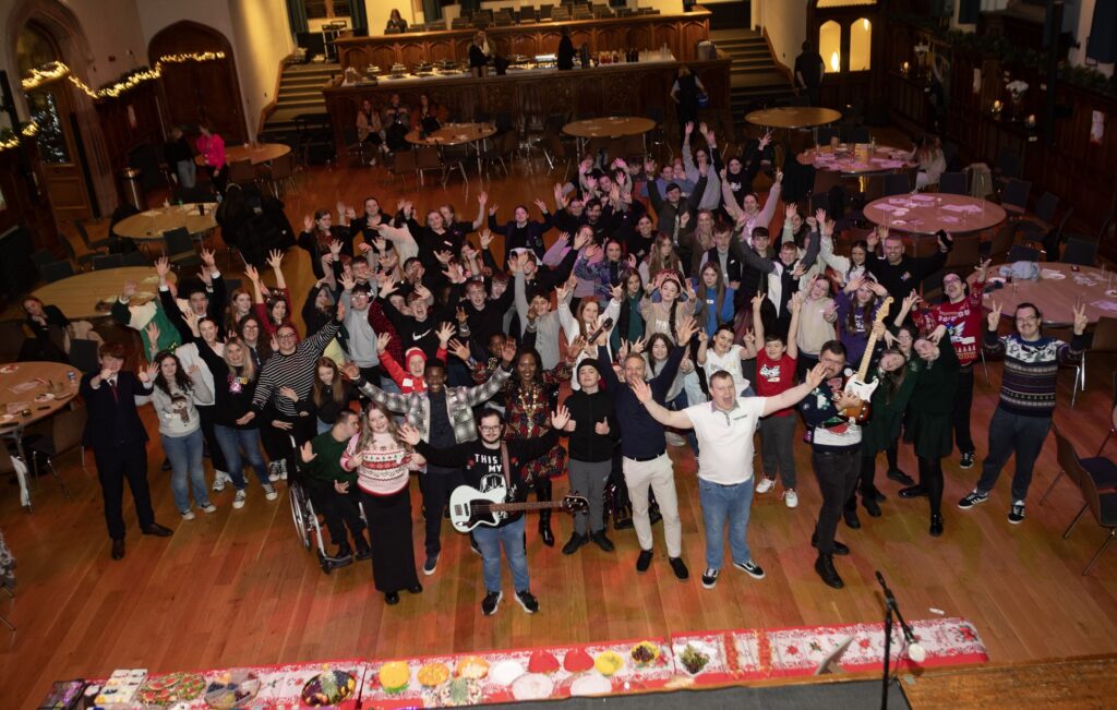 A picture of a group of young people including the Mayor of Derry City and Strabane District Council taken at the Guildhall.