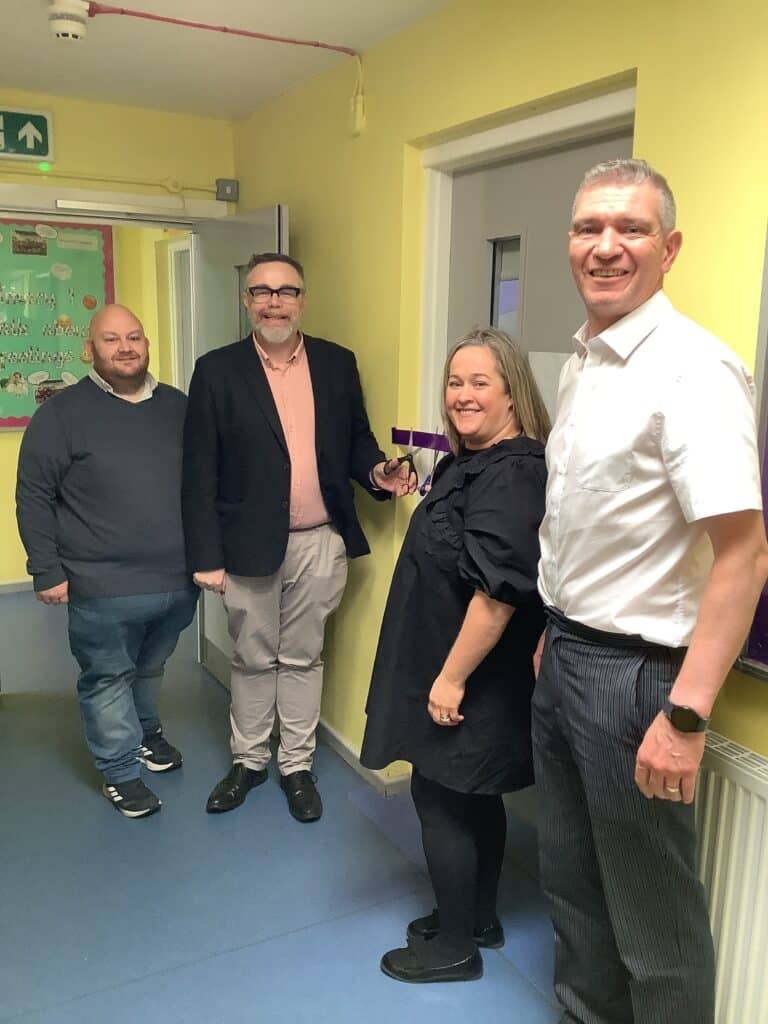 Representatives of Donemana Primary School's Family and Friends Association together with representatives of both The Honourable The Irish Society and the Halifax Foundation for Northern Ireland cut the ribbon on the school's new sensory room